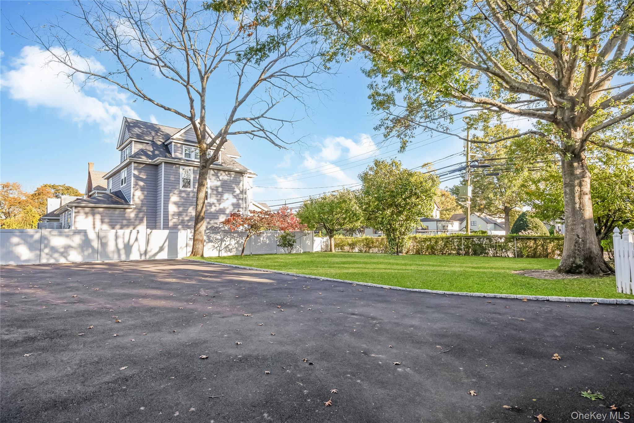 215 Conklin Street Farmingdale, NY 11735 - Photo 8 of 50 a view of road and trees in the background