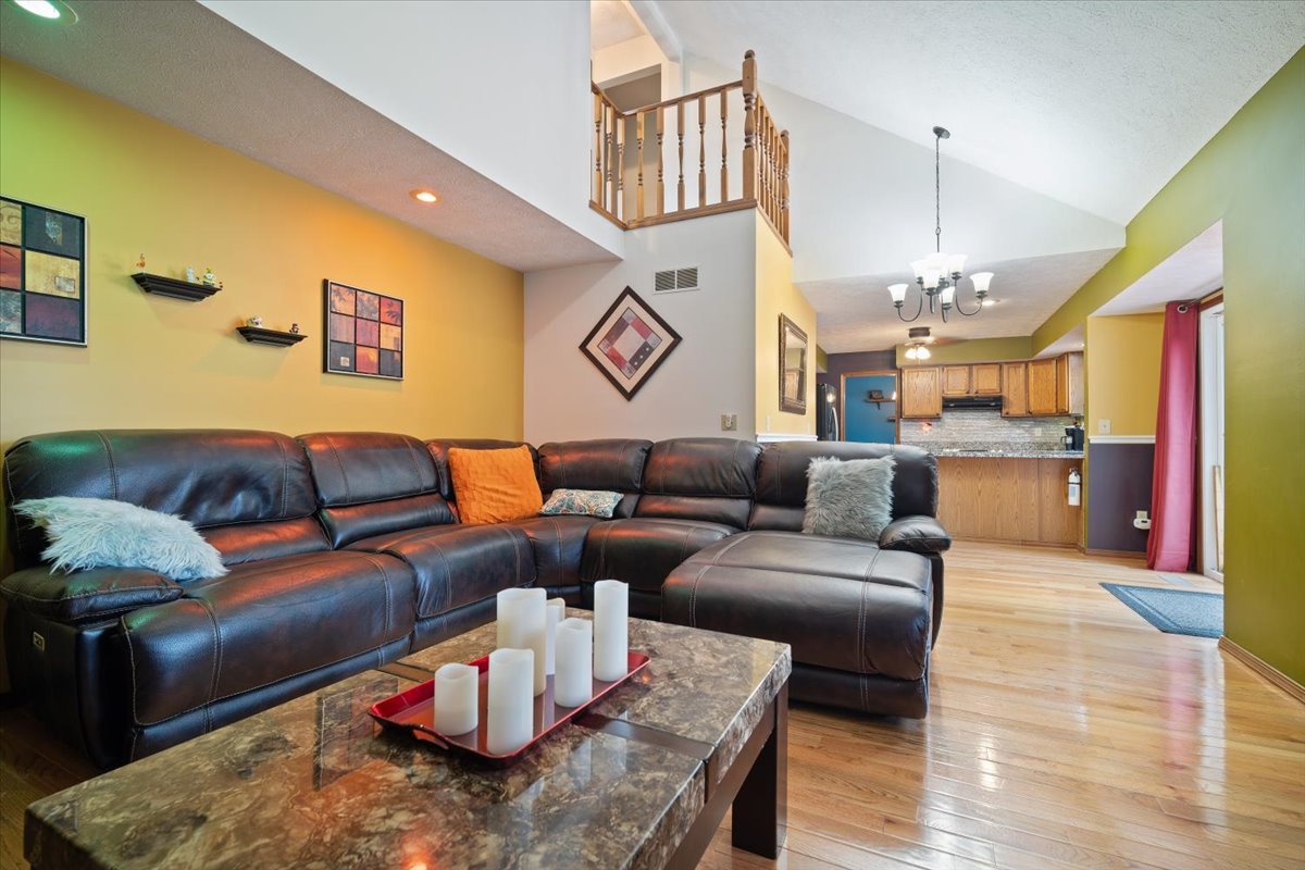 400 Park Pl Drive Normal, IL 61761 - Photo 15 of 33 a living room with furniture kitchen view and a wooden floor