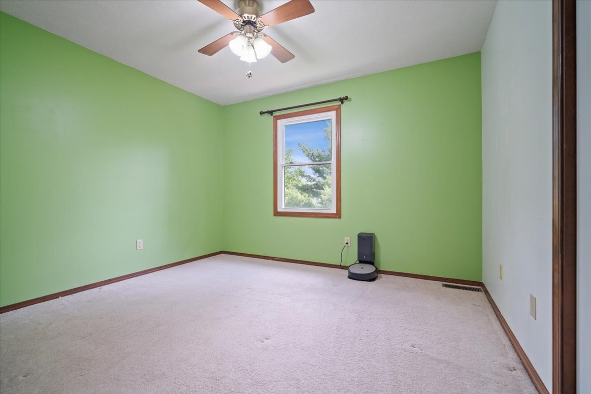 400 Park Pl Drive Normal, IL 61761 - Photo 18 of 33 an empty room with ceiling fan and window