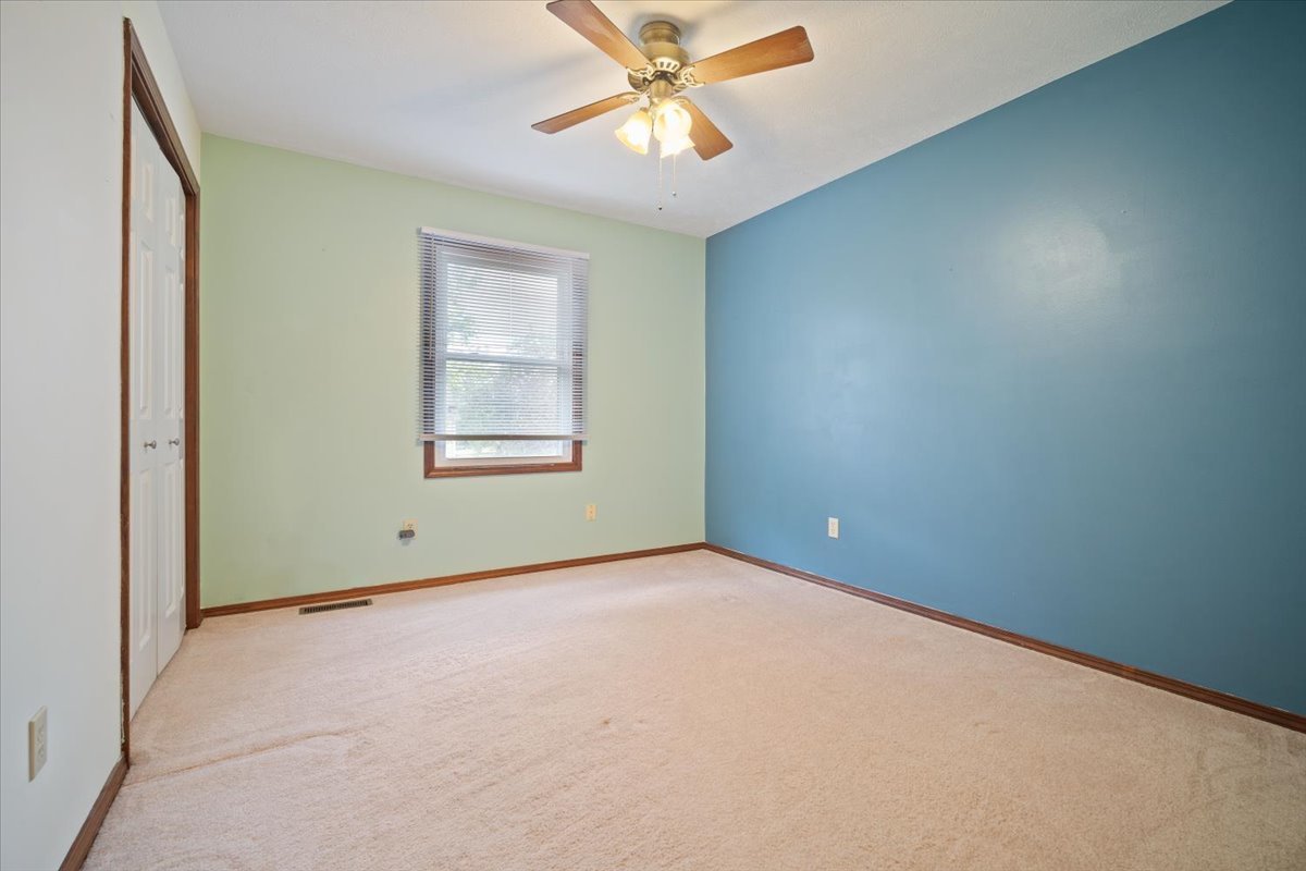 400 Park Pl Drive Normal, IL 61761 - Photo 20 of 33 an empty room with windows and fan