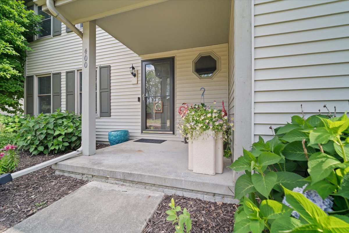 400 Park Pl Drive Normal, IL 61761 - Photo 2 of 33 a potted plant sitting in front of a house