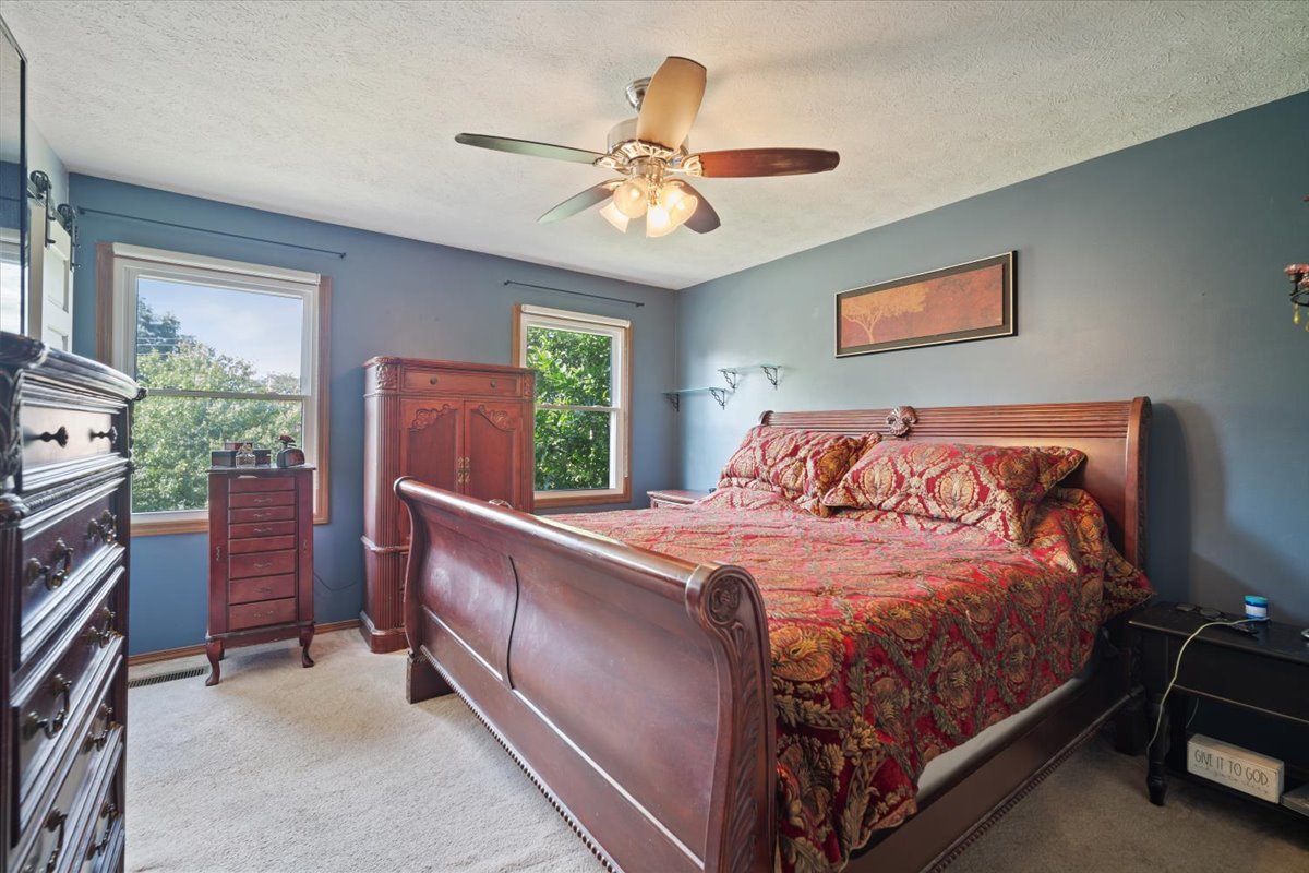 400 Park Pl Drive Normal, IL 61761 - Photo 21 of 33 a bed sitting in a bedroom next to a window