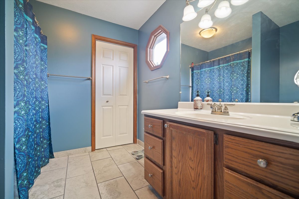 400 Park Pl Drive Normal, IL 61761 - Photo 22 of 33 a bathroom with a sink and a mirror
