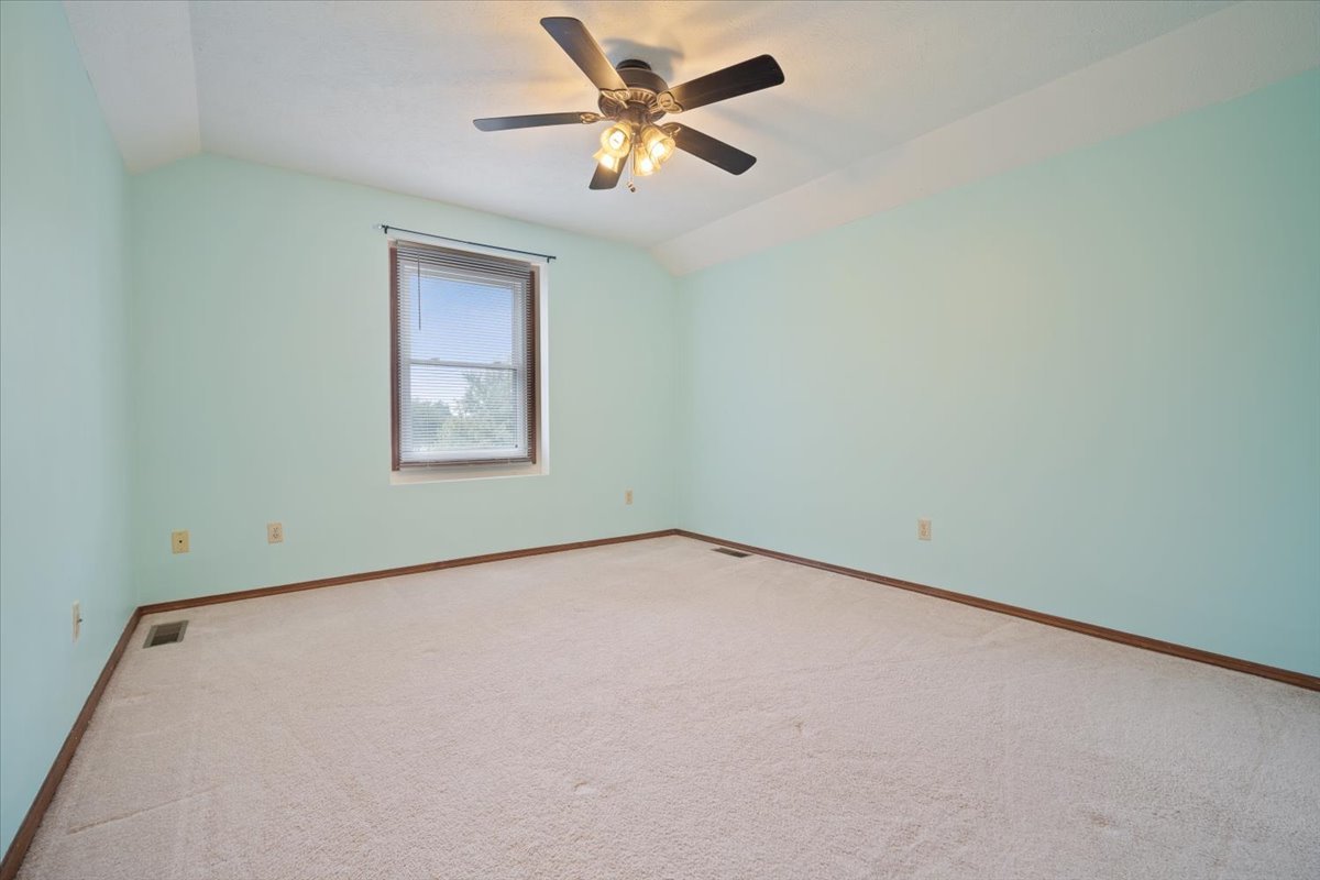 400 Park Pl Drive Normal, IL 61761 - Photo 24 of 33 an empty room with a window and a fan