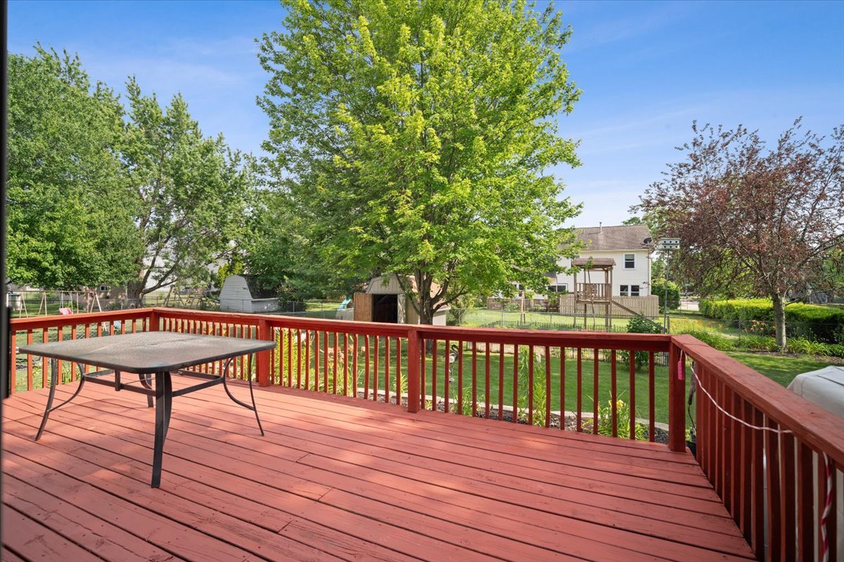400 Park Pl Drive Normal, IL 61761 - Photo 28 of 33 a view of a deck with wooden floor and fence with a large garden