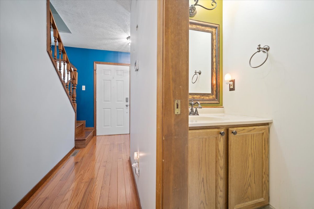 400 Park Pl Drive Normal, IL 61761 - Photo 4 of 33 a bathroom with a sink and a mirror