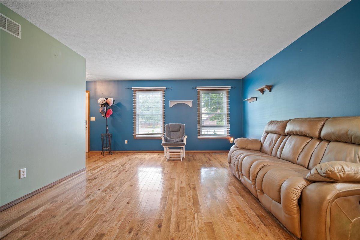 400 Park Pl Drive Normal, IL 61761 - Photo 7 of 33 a living room with furniture and a wooden floor
