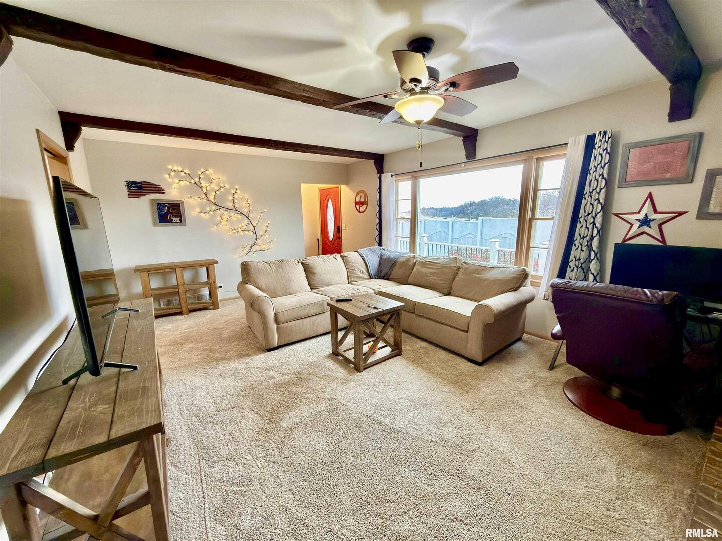 2003 19th Street Moline, IL 61265 - Photo 11 of 39 a living room with furniture and a large window