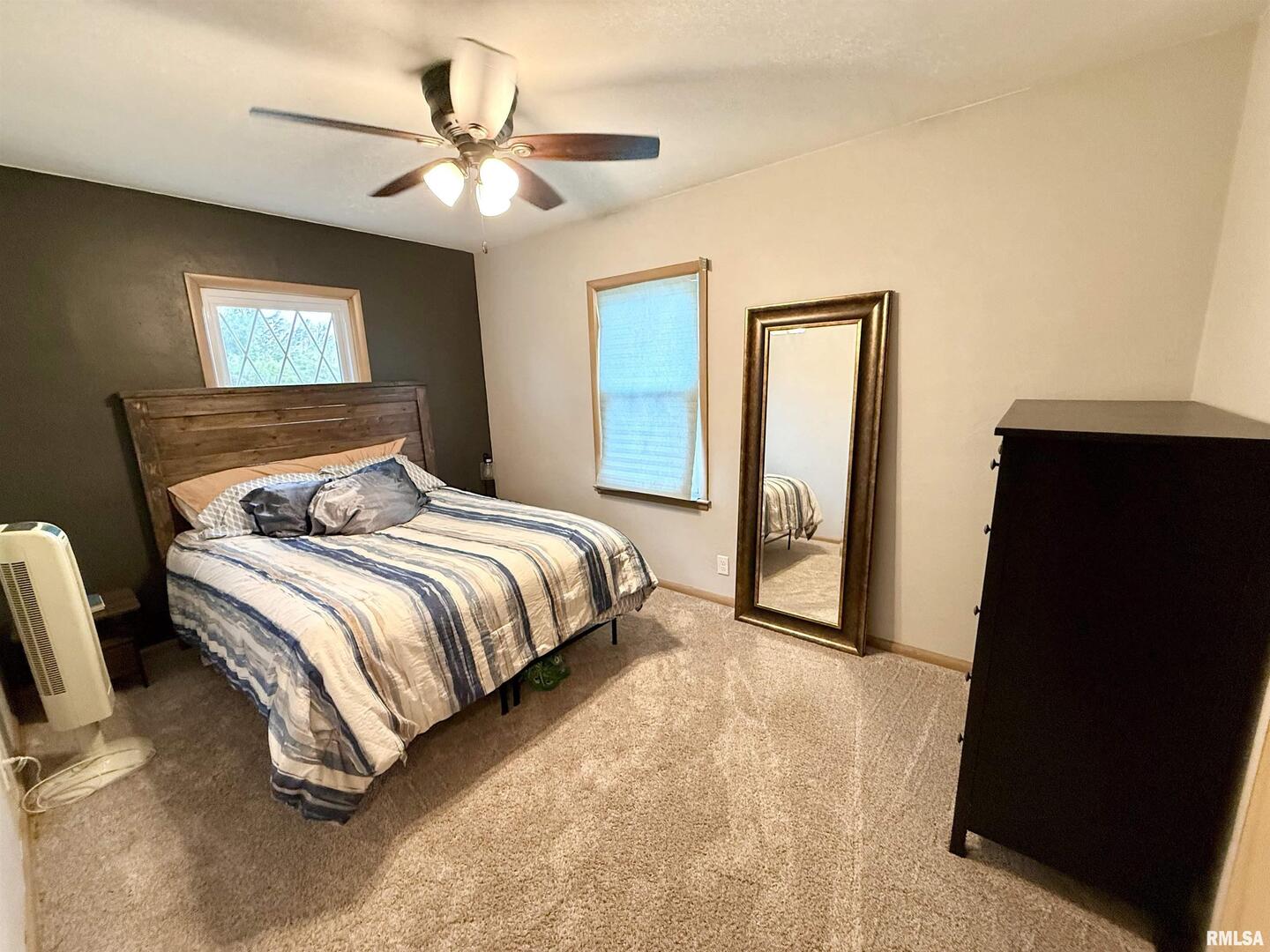 2003 19th Street Moline, IL 61265 - Photo 15 of 39 a bedroom with a bed and a painting on the wall