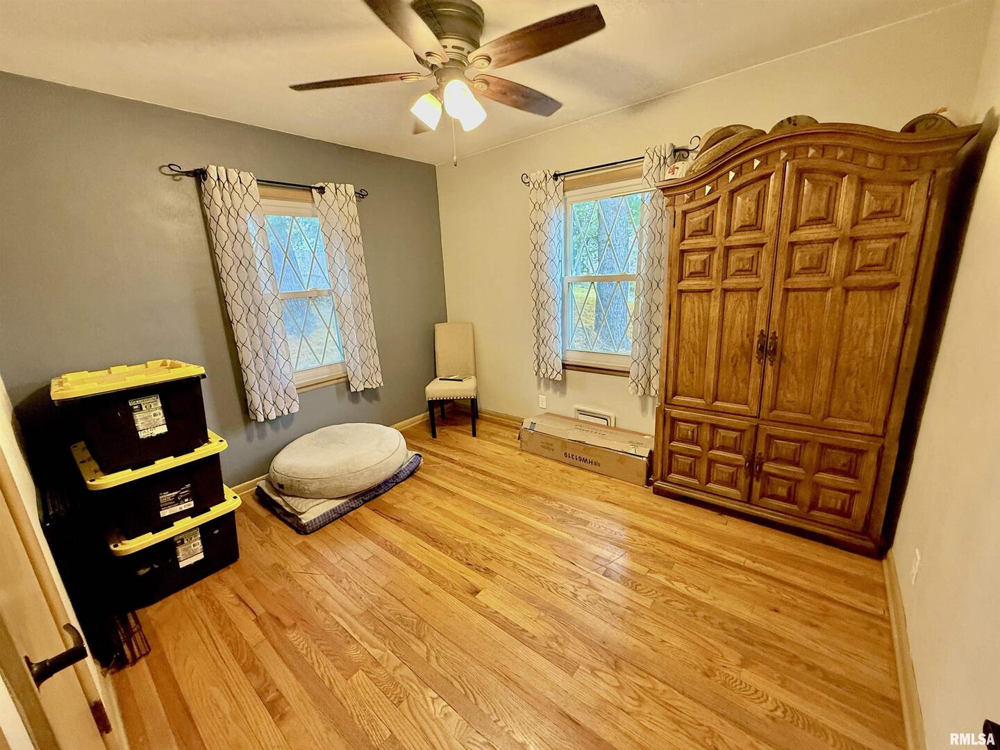 2003 19th Street Moline, IL 61265 - Photo 17 of 39 a bedroom with a bed and wooden floor