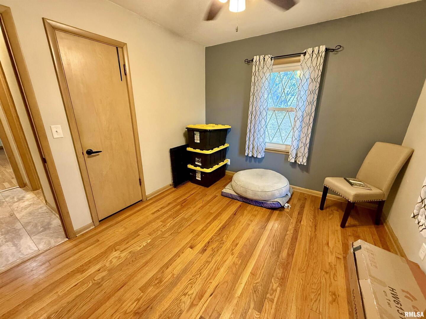 2003 19th Street Moline, IL 61265 - Photo 18 of 39 a bedroom with a bed and wooden floor
