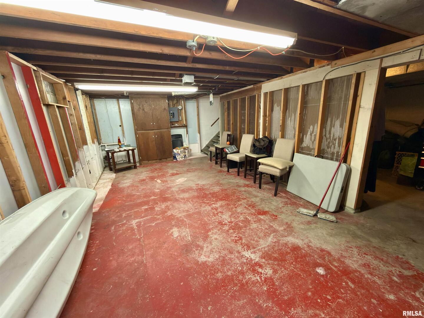 2003 19th Street Moline, IL 61265 - Photo 22 of 39 a view of an empty room with furniture and a window