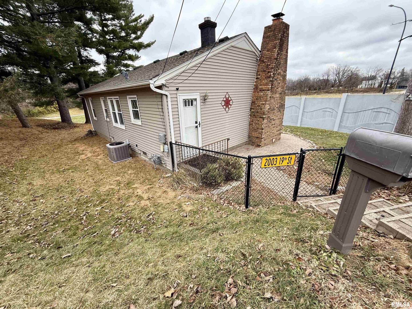 2003 19th Street Moline, IL 61265 - Photo 26 of 39 a view of a house with backyard and sitting area