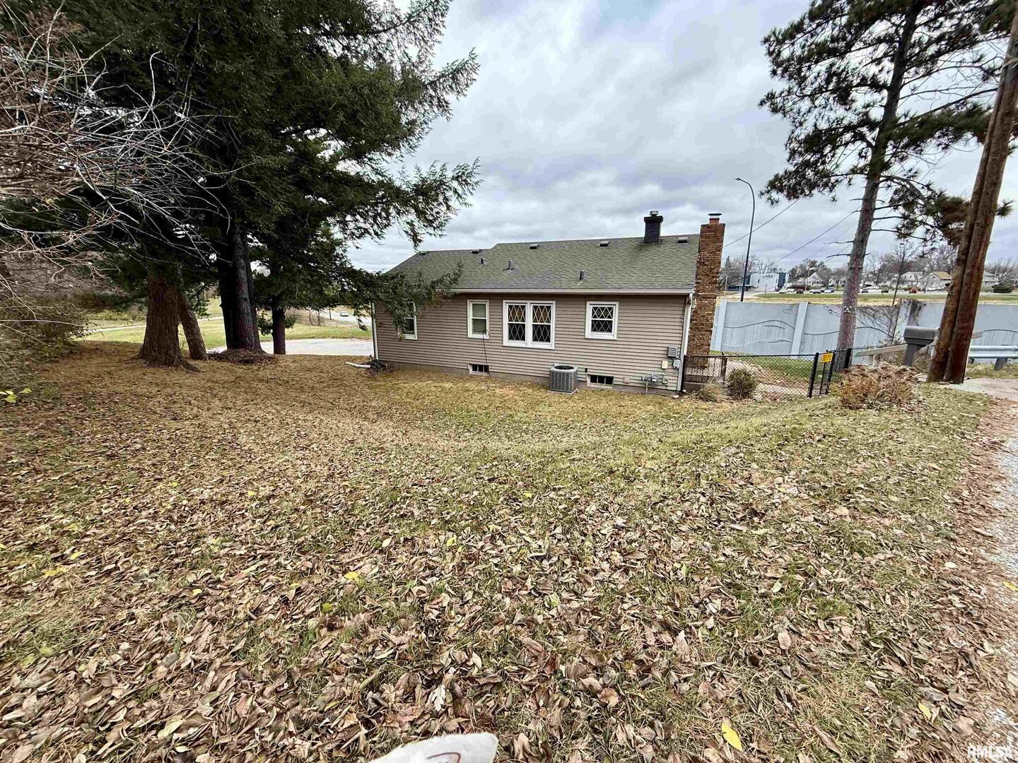 2003 19th Street Moline, IL 61265 - Photo 27 of 39 front view of a house with a large tree