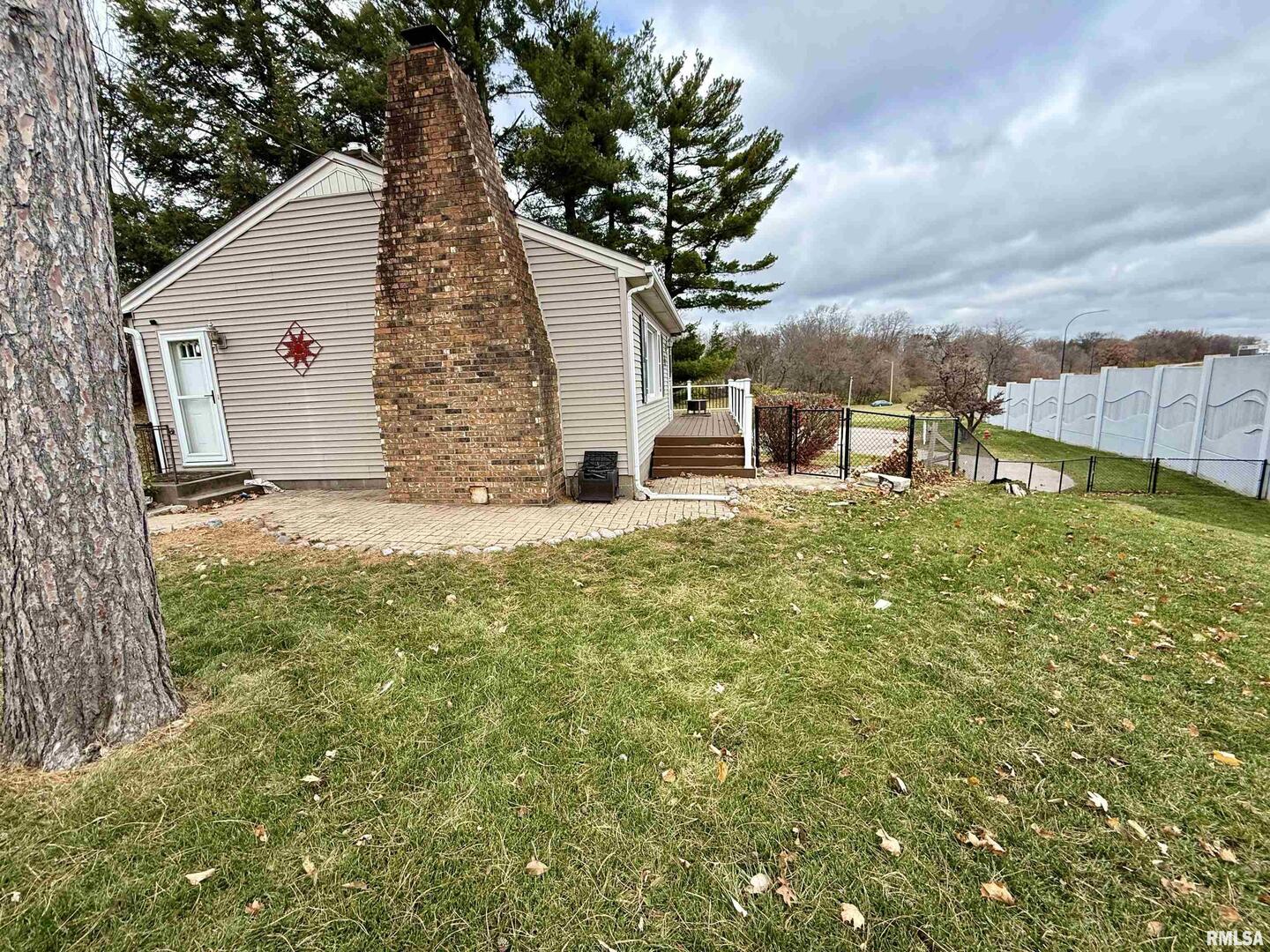 2003 19th Street Moline, IL 61265 - Photo 28 of 39 a view of a house with a yard