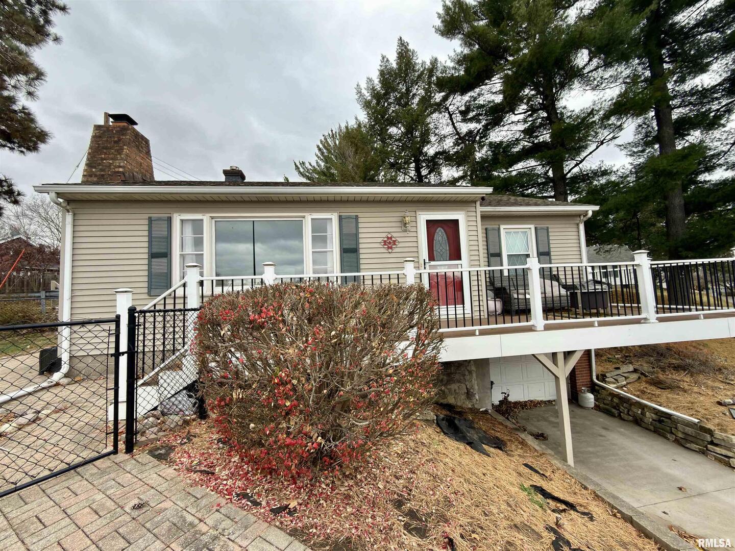 2003 19th Street Moline, IL 61265 - Photo 33 of 39 a view of a house with wooden deck and furniture