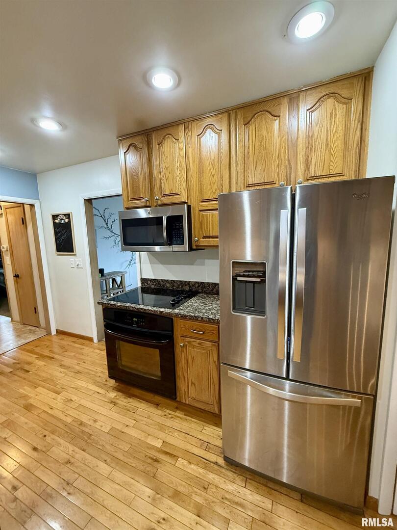 2003 19th Street Moline, IL 61265 - Photo 6 of 39 a kitchen with stainless steel appliances granite countertop a refrigerator a stove and a sink