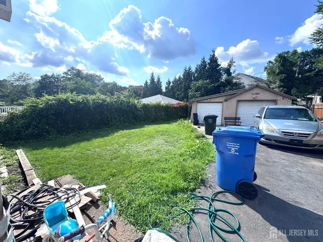 a view of a backyard with sitting area