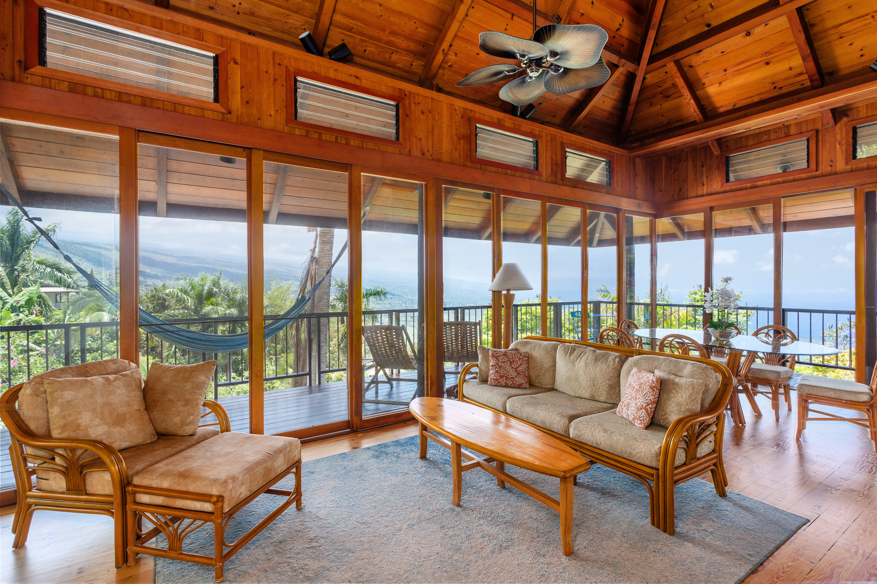 82-5971 Government Main Road Captain Cook, HI 96704 - Photo 3 of 30 a living room with furniture a ceiling fan next to a large window