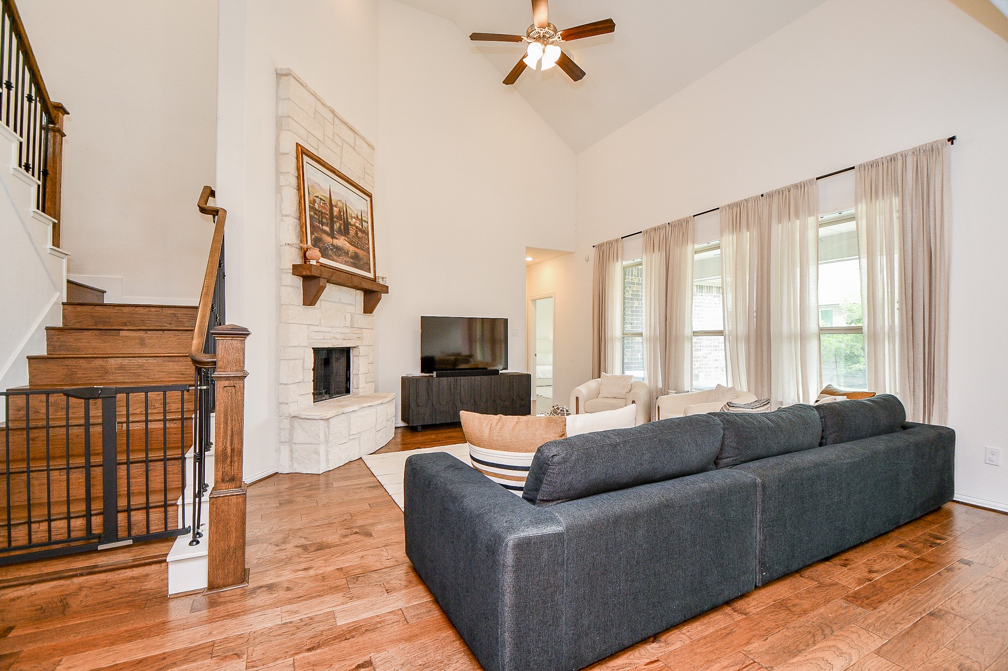 4523 Juniper Ridge Lane Manvel, TX 77578 - Photo 7 of 38 a living room with furniture and a flat screen tv