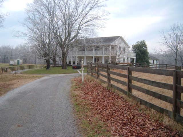 1550 Liberty Road Charlotte, TN 37036 - Photo 2 of 14 Large trees, an orchard & circle driveway around the home.