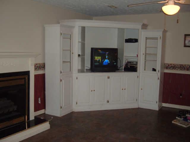1550 Liberty Road Charlotte, TN 37036 - Photo 12 of 14 One of 3 fireplaces & built-in entertainment center.