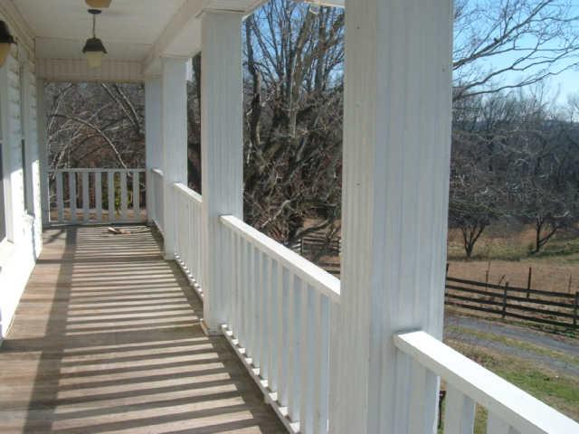 1550 Liberty Road Charlotte, TN 37036 - Photo 9 of 14 Upstairs balcony with doors from bedrooms.