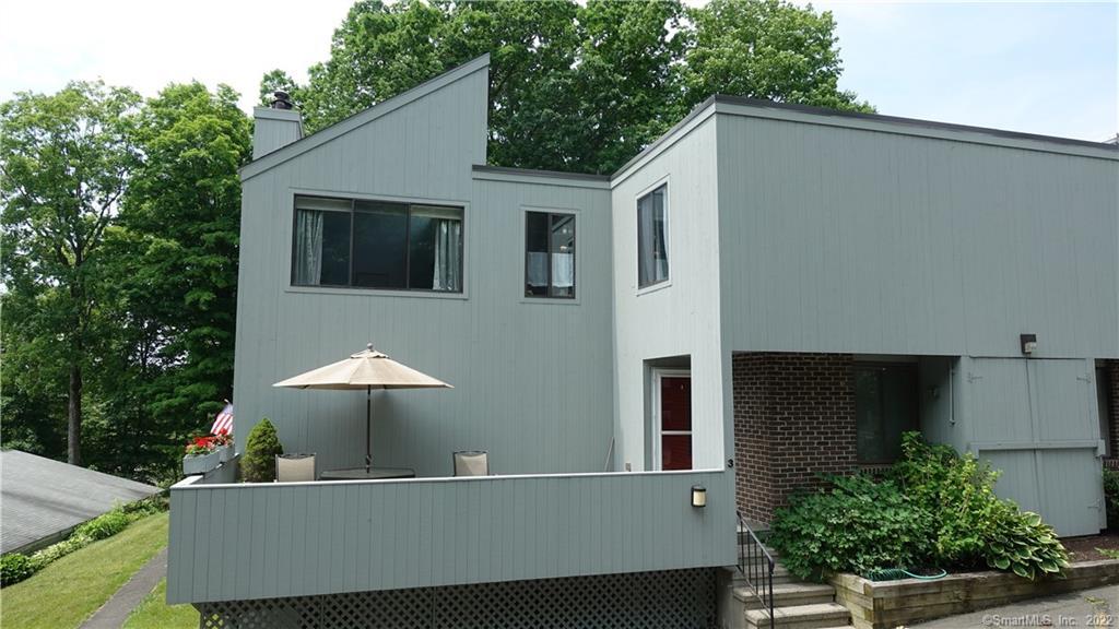 3 Sugar Maple Lane, Unit 3 Ridgefield, CT 06877 - Photo 1 of 1 a view of a house with a balcony and garden