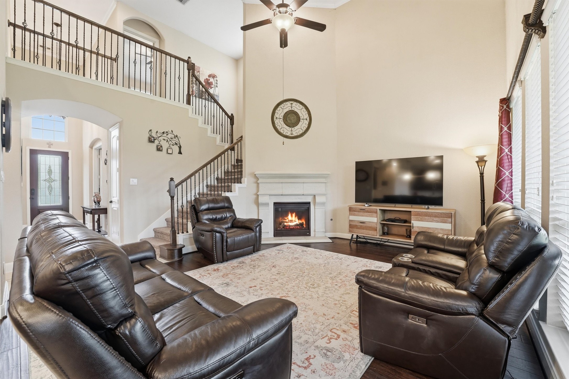 12506 Northpointe Ridge Lane Tomball, TX 77377 - Photo 12 of 31 a living room with furniture a flat screen tv and a fireplace