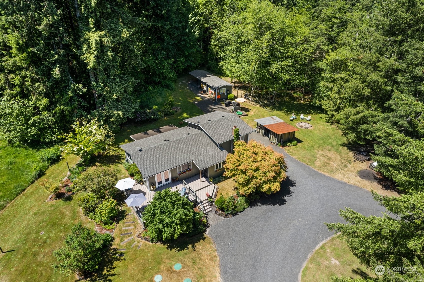 1031 Bunker Creek Road Chehalis, WA 98532 - Photo 1 of 36 an aerial view of a house with a yard and trees