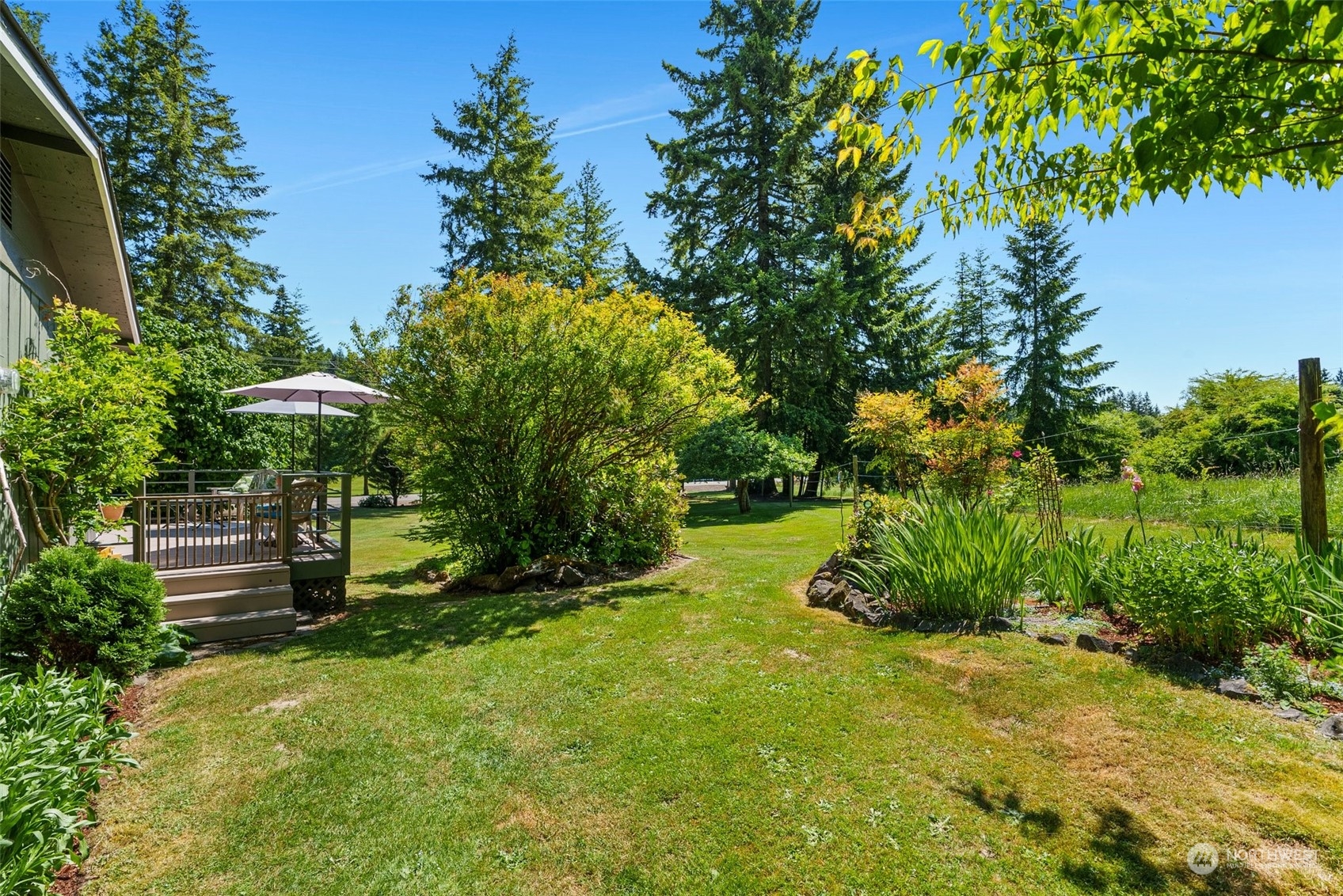 1031 Bunker Creek Road Chehalis, WA 98532 - Photo 25 of 36 a view of a garden with a bench