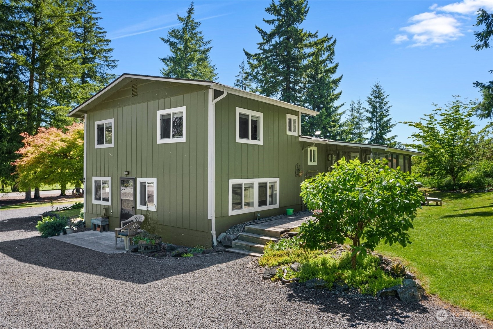 1031 Bunker Creek Road Chehalis, WA 98532 - Photo 3 of 36 a front view of a house with a yard