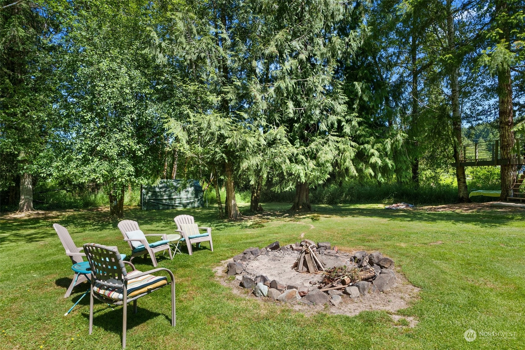 1031 Bunker Creek Road Chehalis, WA 98532 - Photo 31 of 36 a couple of lawn chairs sitting in a yard with swimming pool