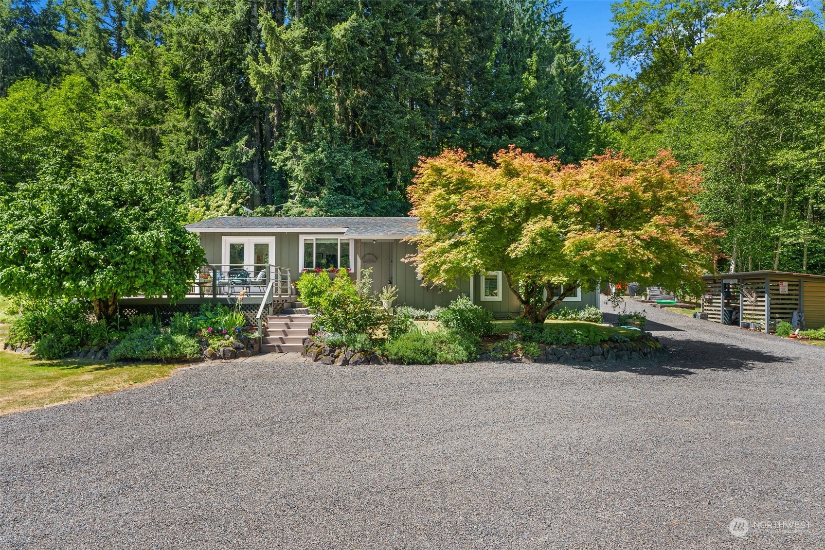 1031 Bunker Creek Road Chehalis, WA 98532 - Photo 33 of 36 a view of a house with a yard and potted plants