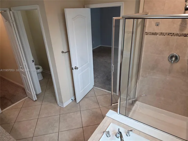 a bathroom with a tub and a shower