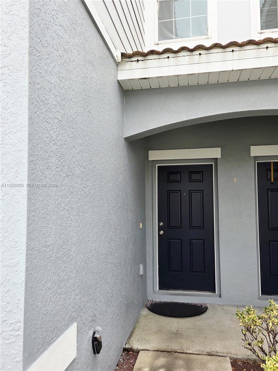 9181 Shepton Street, Unit 9181 Orlando, FL 32825 - Photo 2 of 41 a window with a potted plant on it