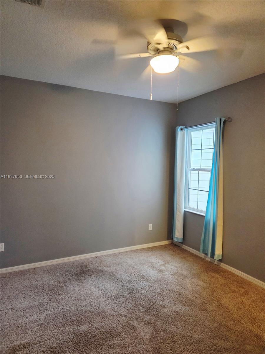 9181 Shepton Street, Unit 9181 Orlando, FL 32825 - Photo 31 of 41 a view of an empty room with a window