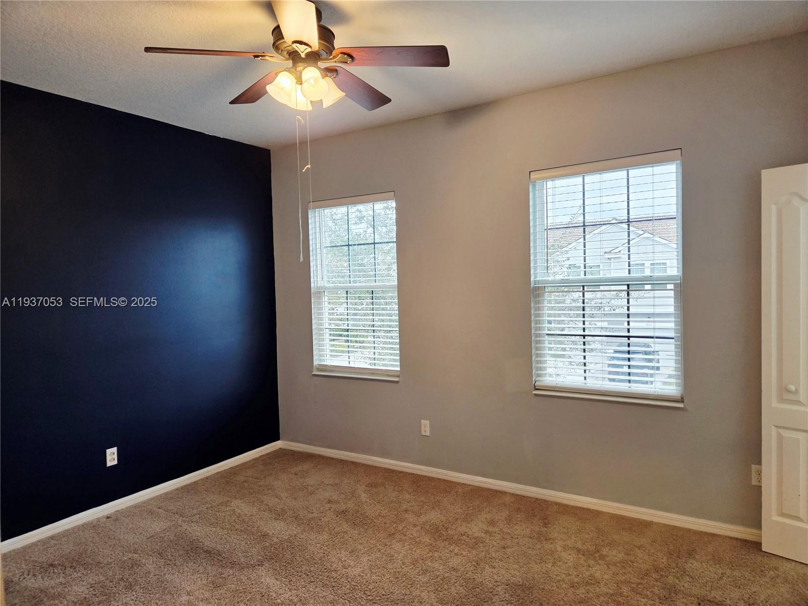 9181 Shepton Street, Unit 9181 Orlando, FL 32825 - Photo 34 of 41 a view of an empty room with a window