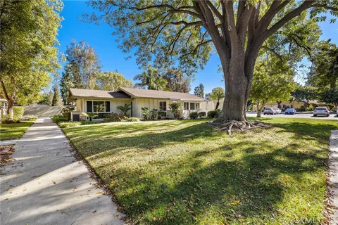 a view of house with yard