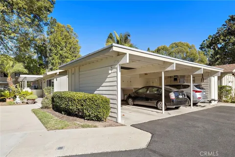 a view of a car parked front of a house