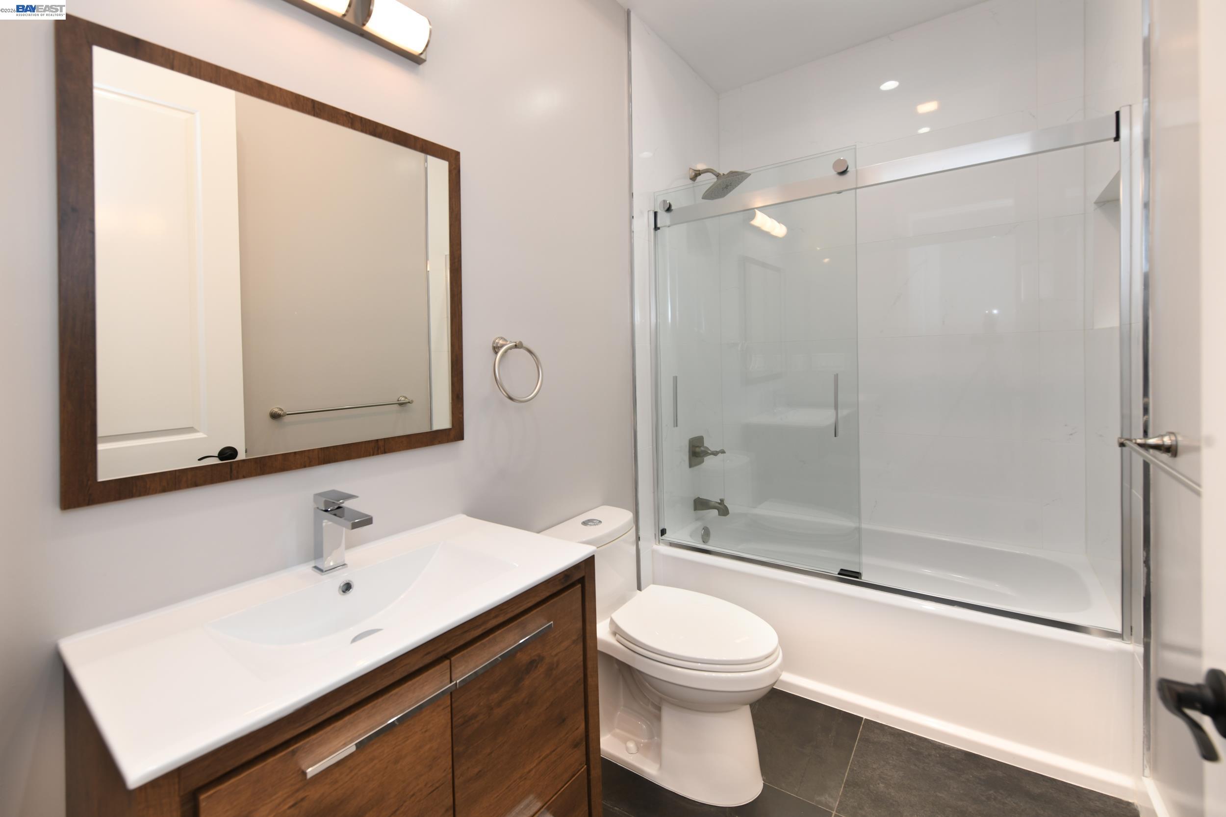 1516 Pleasant Hill Road Lafayette, CA 94549 - Photo 15 of 38 a bathroom with a sink a toilet and shower