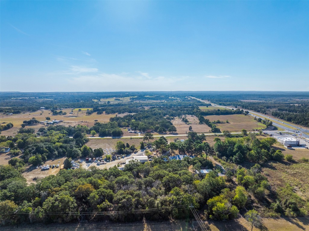 139 Farm To Market 696 Elgin, TX 78621 - Photo 19 of 27 Drone / aerial view of a tree filled landscape