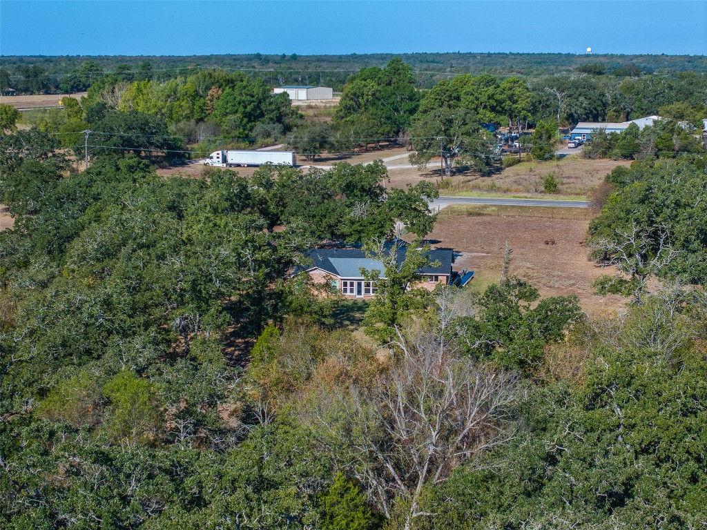 139 Farm To Market 696 Elgin, TX 78621 - Photo 24 of 27 Aerial overview of property's location featuring a heavily wooded area