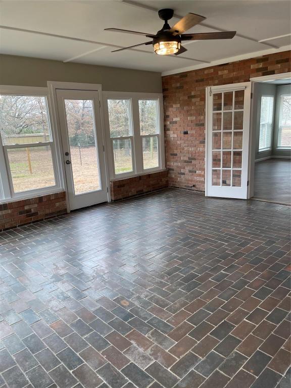 139 Farm To Market 696 Elgin, TX 78621 - Photo 10 of 27 View of unfurnished sunroom