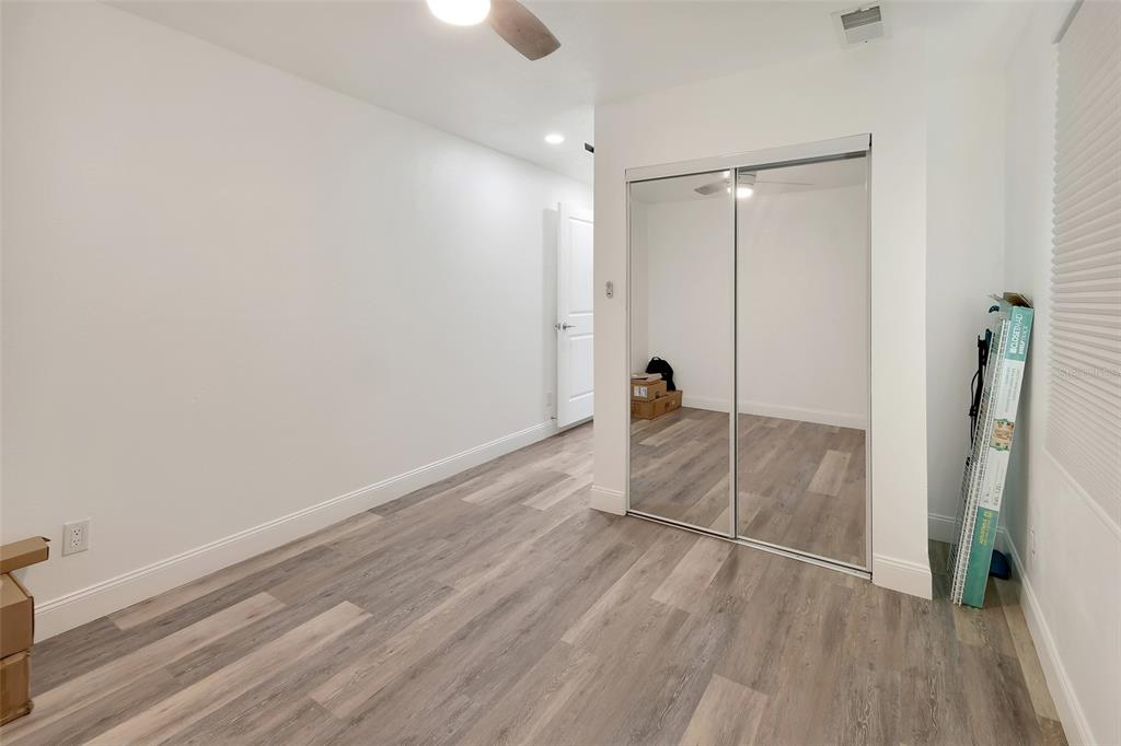 1015 East Howry Avenue Deland, FL 32724 - Photo 11 of 26 a view of empty room with wooden floor