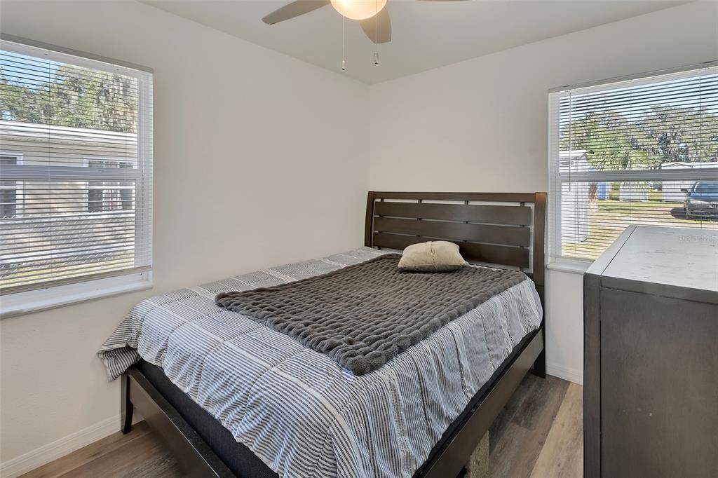 1015 East Howry Avenue Deland, FL 32724 - Photo 13 of 26 a bedroom with a bed and window
