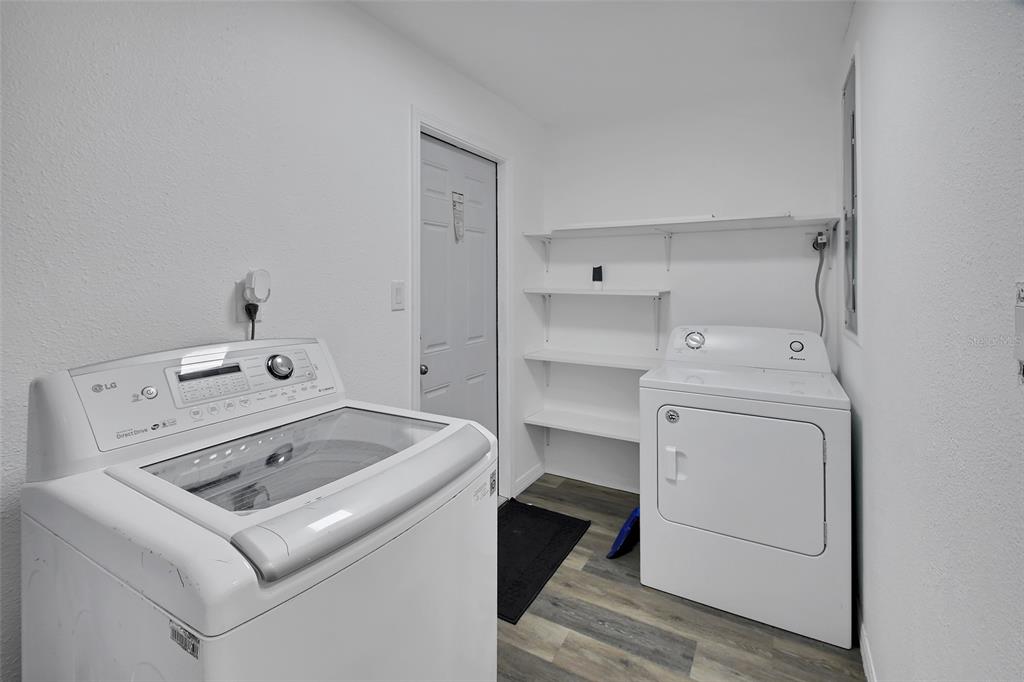 1015 East Howry Avenue Deland, FL 32724 - Photo 20 of 26 a utility room with dryer and washer