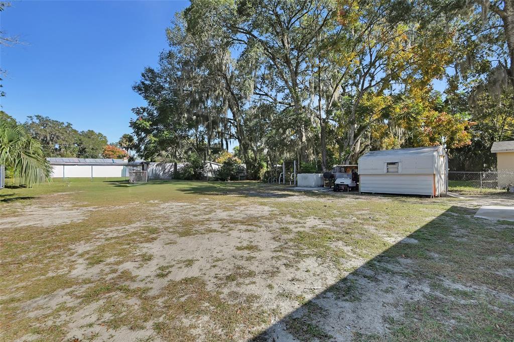 1015 East Howry Avenue Deland, FL 32724 - Photo 23 of 26 a view of a tree with a yard