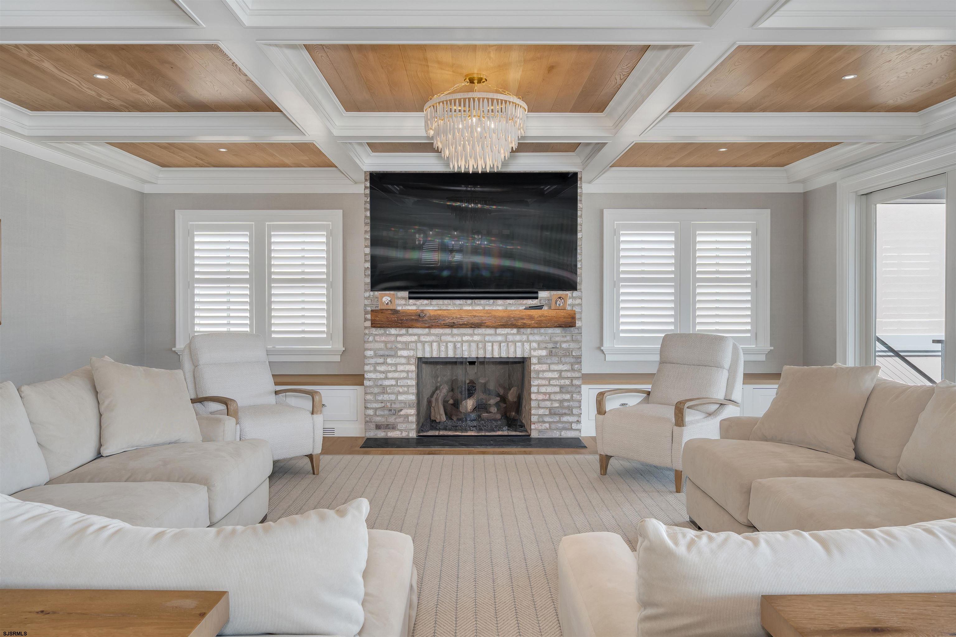 55 Walnut Road Ocean City, NJ 08226 - Photo 11 of 72 a living room with furniture a fireplace and a large window