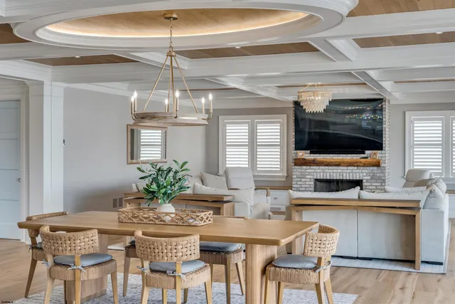 a view of a dining room with furniture wooden floor and chandelier